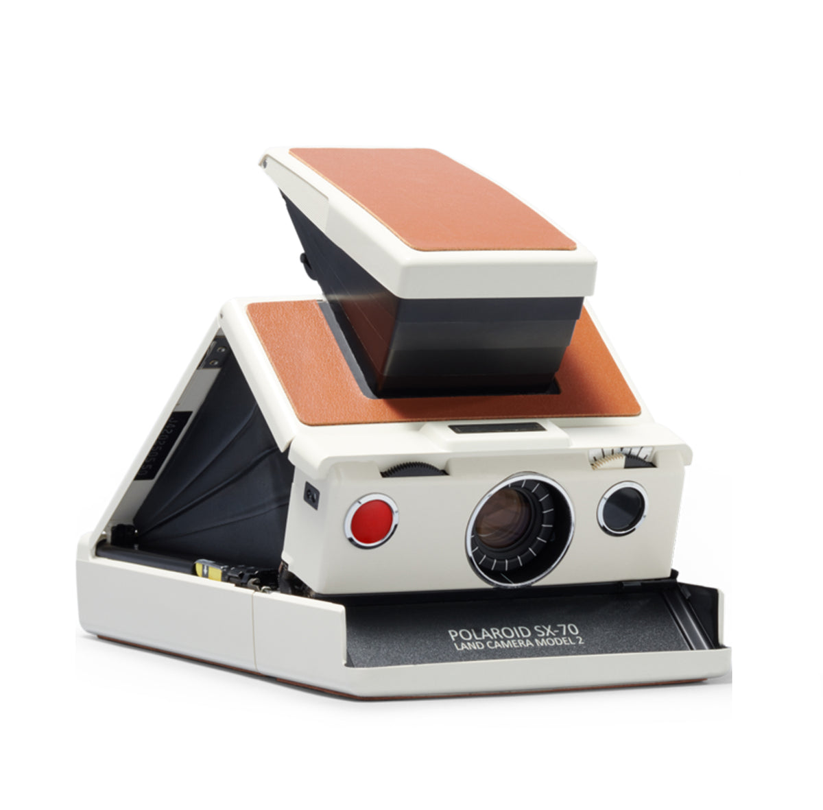 Una macchina fotografica Polaroid seduta sopra un tavolo di legno